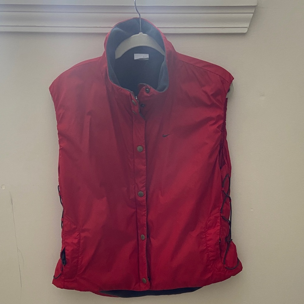 Nike Red perforated Puffer Vest with side adjustment lacing.